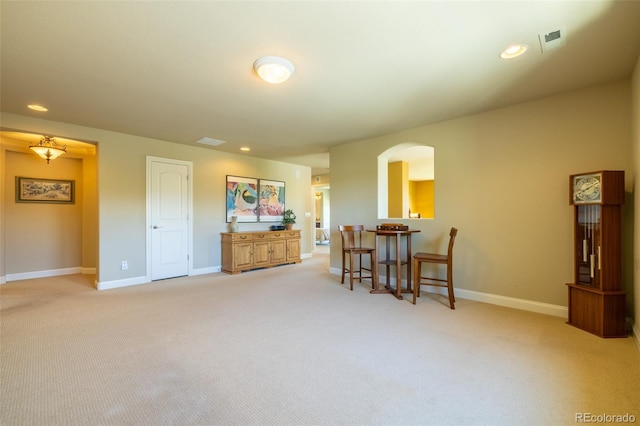 27565 E Nova Pl, Aurora, CO 80016 - living area with arched walkways, light carpet, and recessed lighting