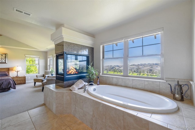 27565 E Nova Pl, Aurora, CO 80016 - full bathroom with a bath, tile patterned flooring, lofted ceiling, and a multi sided fireplace