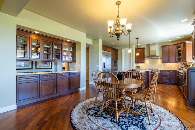 27565 E Nova Pl, Aurora, CO 80016 - dining area featuring a chandelier, dark wood-style floors, and recessed lighting