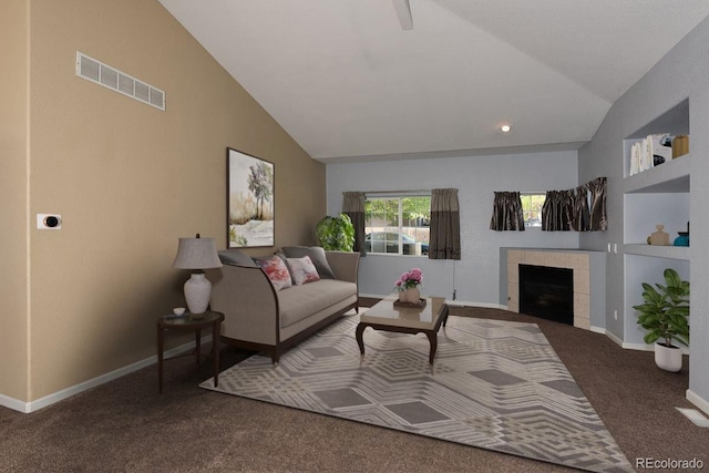 carpeted living room featuring a tiled fireplace, baseboards, and high vaulted ceiling