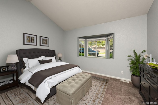 bedroom featuring vaulted ceiling, baseboards, and carpet flooring