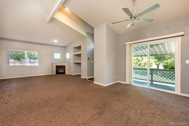 9025 W 79th Way Unit D, Arvada, CO 80005 - unfurnished living room with lofted ceiling, dark carpet, a fireplace, and a ceiling fan