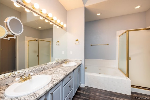 9025 W 79th Way Unit D, Arvada, CO 80005 - bathroom featuring a shower stall, wood finished floors, double vanity, and a jetted tub