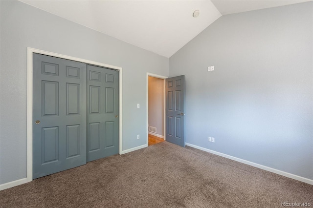 9025 W 79th Way Unit D, Arvada, CO 80005 - unfurnished bedroom with lofted ceiling, carpet, and a closet