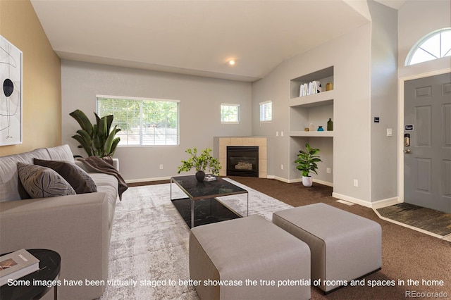 9025 W 79th Way Unit D, Arvada, CO 80005 - carpeted living room featuring built in shelves and a tiled fireplace