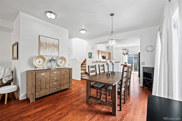 dining space featuring dark wood-type flooring