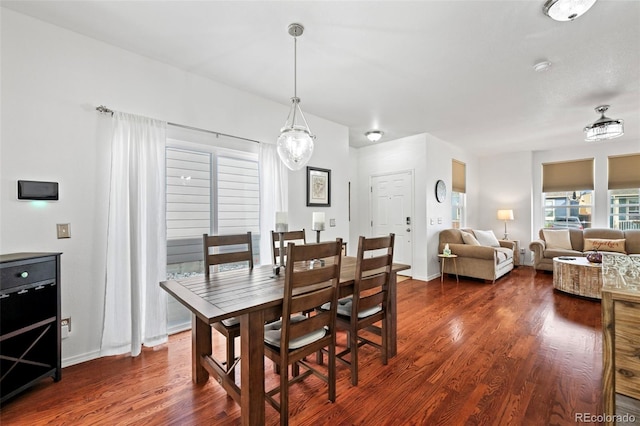 dining space featuring dark hardwood / wood-style flooring