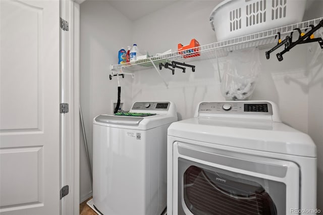 laundry room with independent washer and dryer