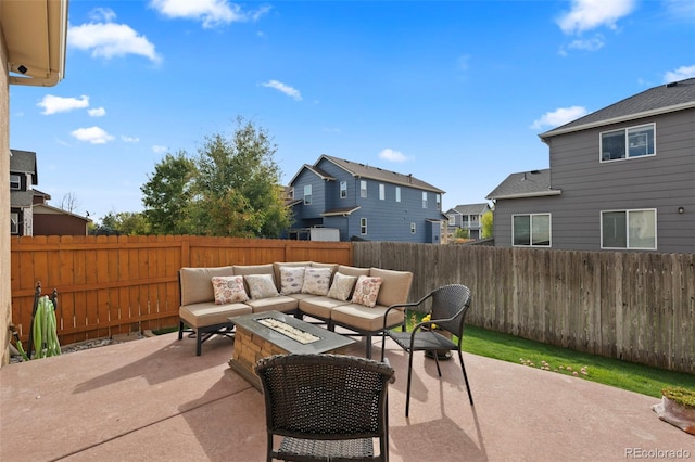 view of patio / terrace featuring an outdoor living space with a fire pit