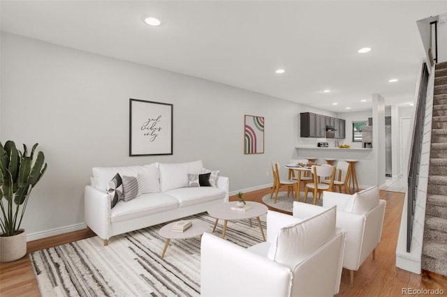 7474 E Arkansas Ave Unit 18-10, Denver, CO 80231 - living room with stairs, light wood-style flooring, and recessed lighting