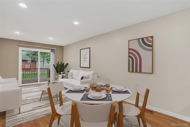 7474 E Arkansas Ave Unit 18-10, Denver, CO 80231 - dining area with wood finished floors and recessed lighting