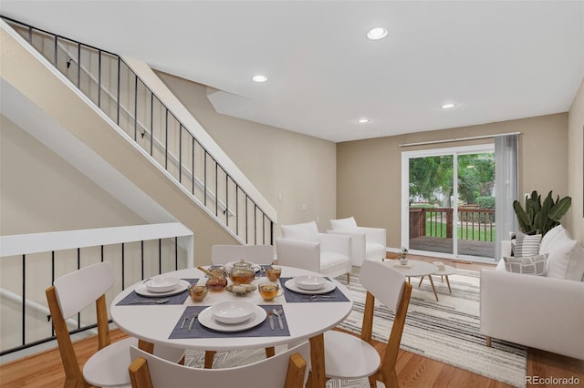 7474 E Arkansas Ave Unit 18-10, Denver, CO 80231 - dining space featuring wood finished floors, recessed lighting, and stairs