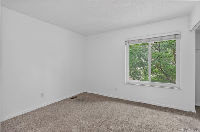 7474 E Arkansas Ave Unit 18-10, Denver, CO 80231 - spare room featuring carpet flooring