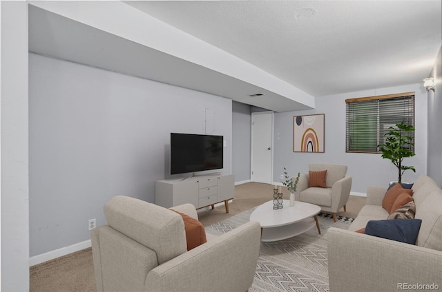 7474 E Arkansas Ave Unit 18-10, Denver, CO 80231 - living room featuring baseboards and carpet flooring