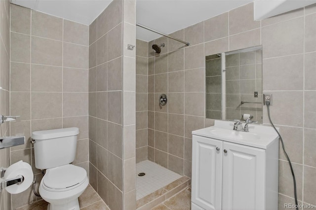 7474 E Arkansas Ave Unit 18-10, Denver, CO 80231 - full bathroom featuring tile walls, tiled shower, and vanity
