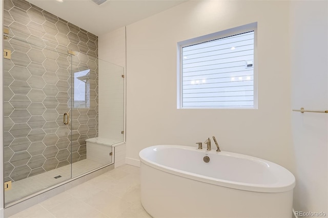 231 Leafy Aster Ln, Castle Rock, CO 80104 - bathroom with a soaking tub, a stall shower, and tile patterned floors