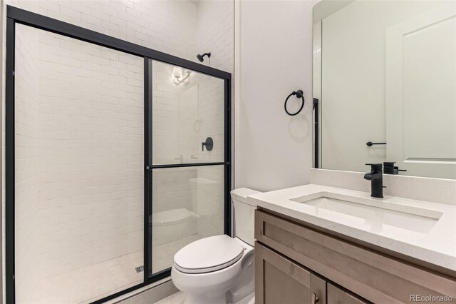231 Leafy Aster Ln, Castle Rock, CO 80104 - bathroom featuring a shower stall, toilet, and vanity