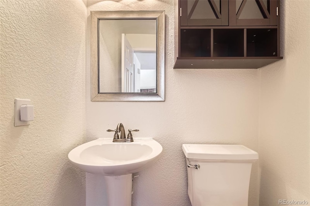 bathroom featuring toilet