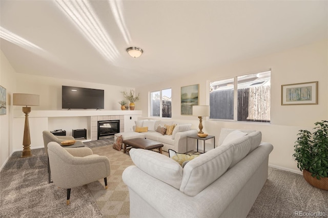 living room featuring a fireplace and carpet floors