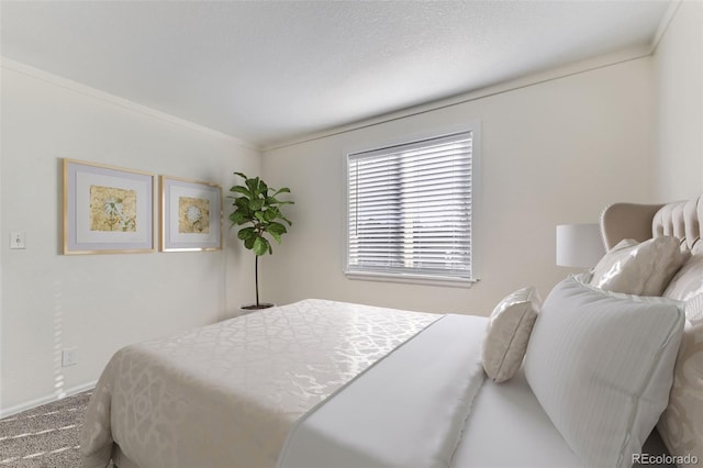 bedroom featuring carpet flooring and crown molding