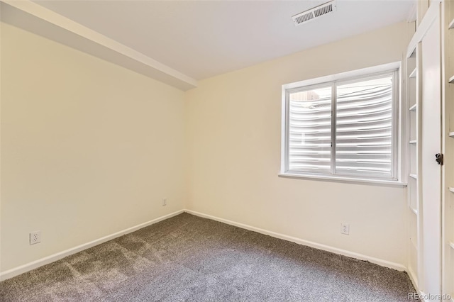 spare room featuring carpet floors