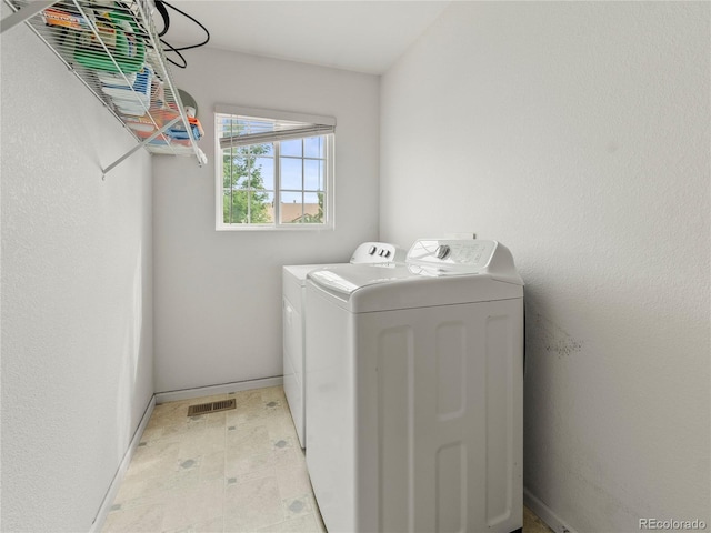 4906 Perth St, Denver, CO 80249 - laundry room featuring washing machine and dryer and light flooring