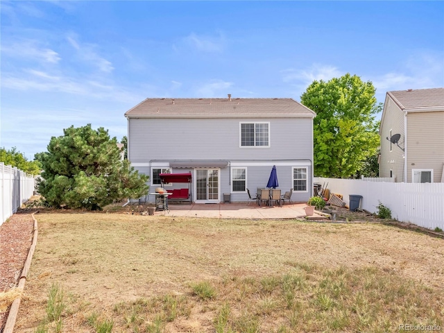 4906 Perth St, Denver, CO 80249 - rear view of property with a patio and a fenced backyard