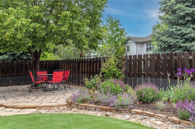 6520 S Newcastle Way, Aurora, CO 80016 - fenced backyard with a patio