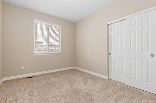 6520 S Newcastle Way, Aurora, CO 80016 - unfurnished bedroom featuring carpet, baseboards, and a closet