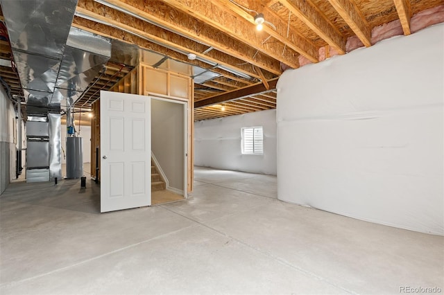 6520 S Newcastle Way, Aurora, CO 80016 - basement featuring water heater, stairs, and heating unit