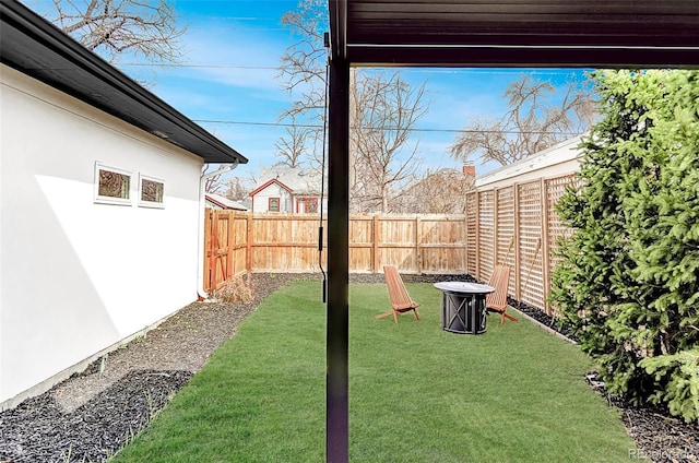 view of yard with a fenced backyard