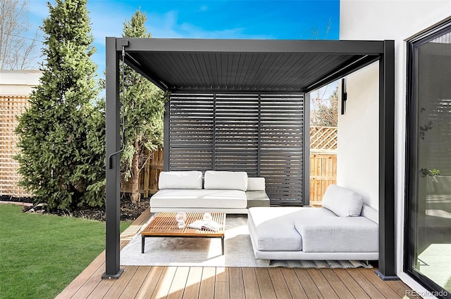 wooden terrace with outdoor lounge area and a lawn