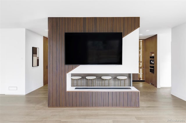 interior details with wood finished floors and recessed lighting