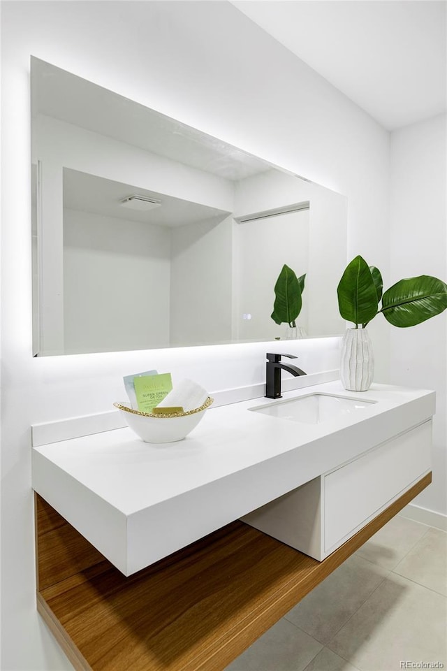 bathroom featuring tile patterned floors and vanity