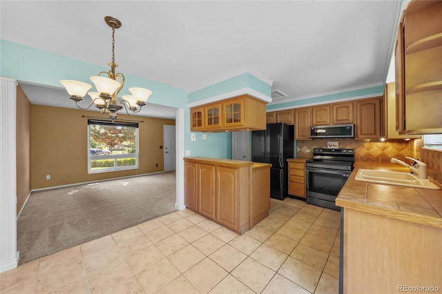 16563 E Kansas Pl, Aurora, CO 80017 - kitchen with stainless steel appliances, light colored carpet, glass insert cabinets, a chandelier, and tasteful backsplash
