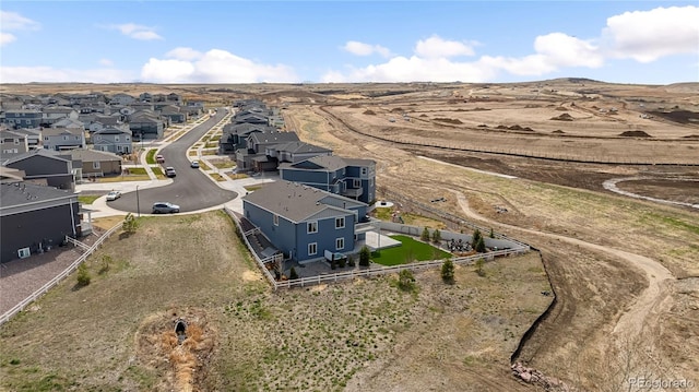 birds eye view of property with a residential view