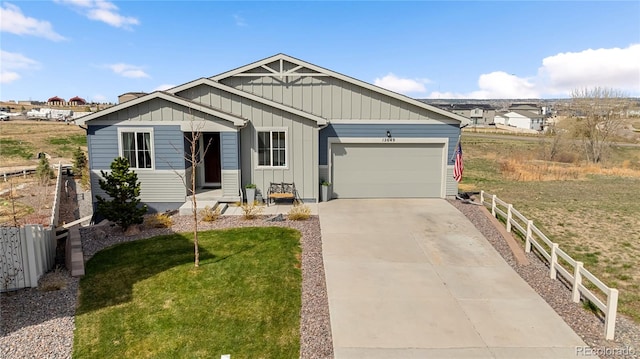 craftsman-style house with an attached garage, board and batten siding, fence, and concrete driveway