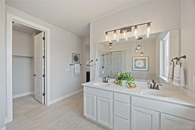 full bath with double vanity, a sink, and a shower stall