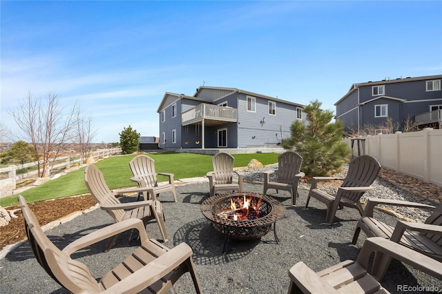 view of patio with fence and an outdoor fire pit