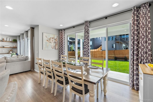 dining area featuring light wood-style flooring and recessed lighting