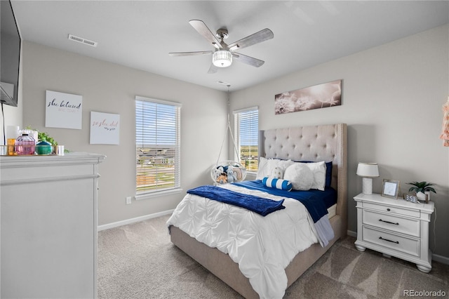 bedroom with a ceiling fan, carpet, visible vents, and baseboards