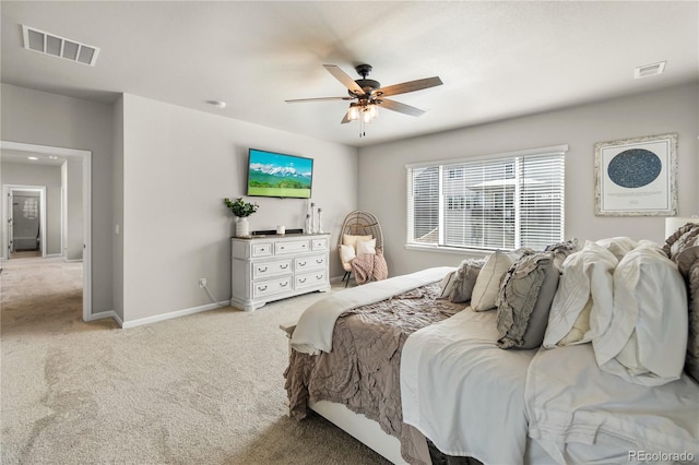 bedroom featuring visible vents, ceiling fan, light carpet, and baseboards