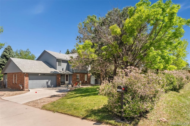 4390 S Sheridan Blvd, Littleton, CO 80123 - traditional-style house with brick siding, a garage, concrete driveway, a front yard, and a shingled roof