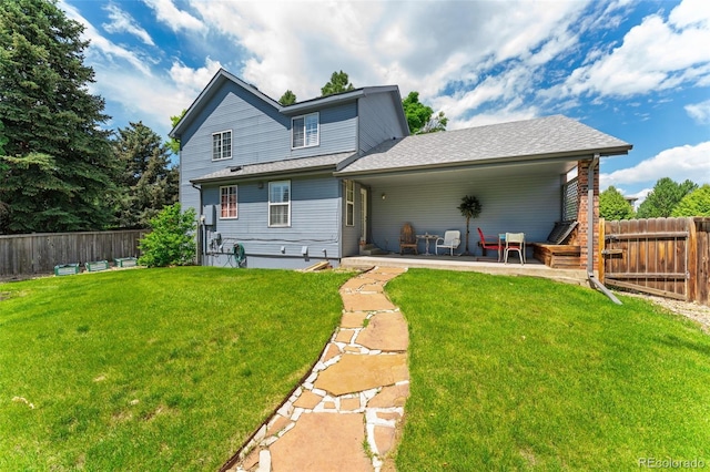 4390 S Sheridan Blvd, Littleton, CO 80123 - back of property featuring a fenced backyard and roof with shingles