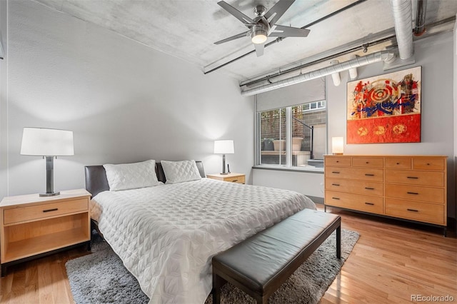 bedroom with ceiling fan and light hardwood / wood-style floors