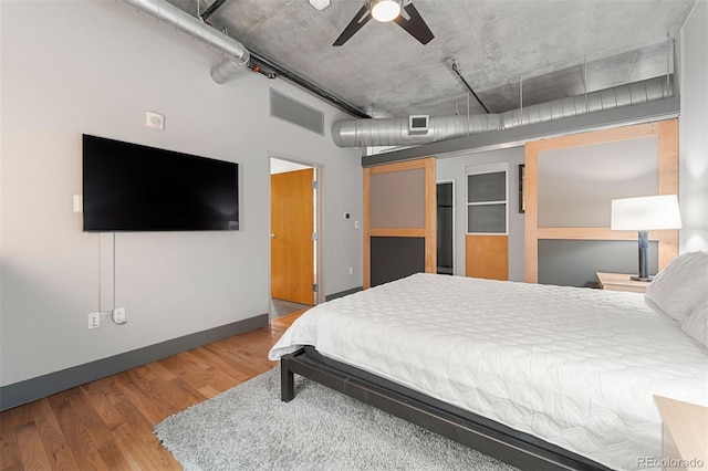 bedroom featuring ceiling fan and hardwood / wood-style floors