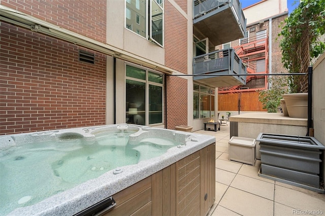 view of patio with a hot tub