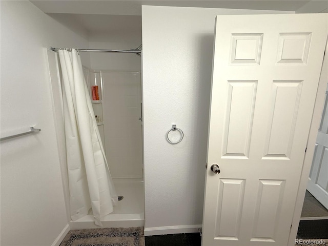 183 E Ave, Limon, CO 80828 - full bathroom with baseboards and a stall shower