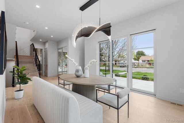 dining area with stairs, light wood-type flooring, recessed lighting, and baseboards