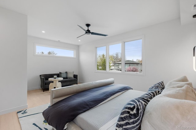 bedroom featuring light wood-type flooring, ceiling fan, recessed lighting, and baseboards